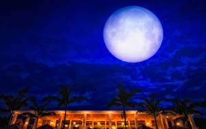 Hd Moon Above Resort Building Wallpaper