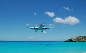 Hd Plane Flying Over Beach Wallpaper