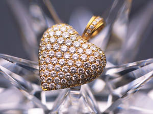 Heart Gold Jewelry With Emeralds Wallpaper