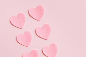 Heart Shaped Cutouts In Soft Ravishing Hues Wallpaper