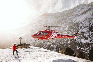 Helicopter On Snowy Mountain Wallpaper