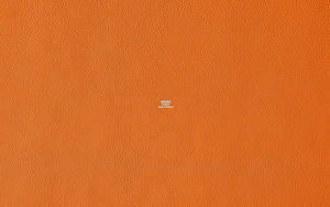Hermes Logo On Textured Orange Background Wallpaper