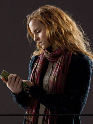 Hermione Granger With A Book Wallpaper