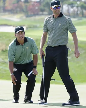 Hideki Matsuyama With Fellow Golfer Wallpaper