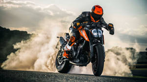 High-speed Adventure Awaits With The Ktm 390 Adventure Bike Wallpaper