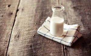 Homely Glass Of Milk On Top Of Wood Wallpaper