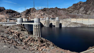 Hoover Dam In Rocky Terrain Wallpaper