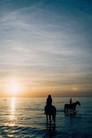 Horseback Riding Girls On Beach Wallpaper