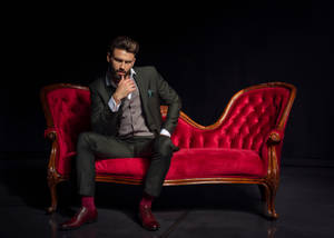 Hot Guy On Red Couch Wallpaper