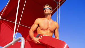 Hot Lifeguard On Duty At The Beach Wallpaper