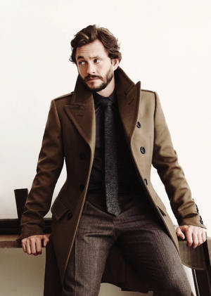 Hugh Dancy In Brown Coat Wallpaper