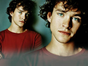 Hugh Dancy In Red Shirt Wallpaper