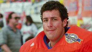 Humorous Football Player Adam Sandler Wallpaper