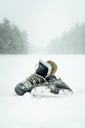 Ice Hockey Shoes In Snow Wallpaper