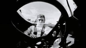 Iconic American Actor Steve Mcqueen Poses In ‘the Man And Le Mans’ Wallpaper