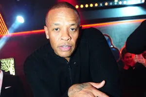 Iconic Music Producer Dr. Dre In His Studio Wallpaper