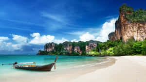 Idyllic Thai Beach With Longtail Boat Wallpaper