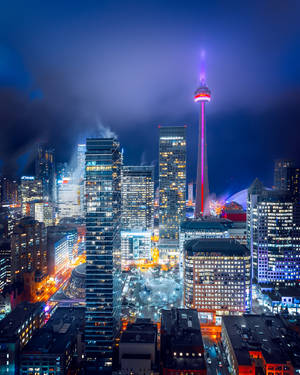 Illuminated Cityscape Against The Night Sky Wallpaper