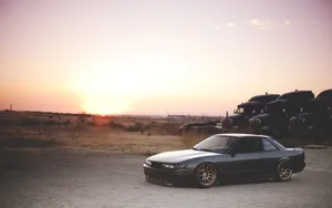 Image A Nissan Silvia S13 Sitting In A Car Park Wallpaper