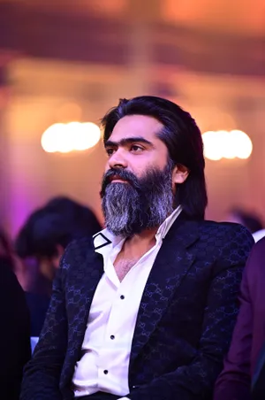 Indian Actor Simbu Displaying His Mature Charm In Gray Beard Wallpaper