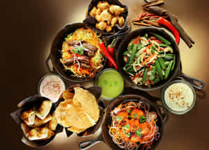 Indian Food In Black Pans Wallpaper