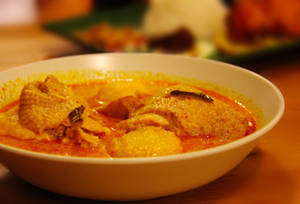 Indulgent Indian Yellow Curry Chicken Dish Wallpaper