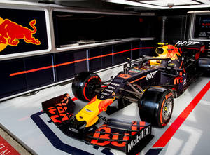 Inside The Fast-paced Operations Of Red Bull Racing Garage Wallpaper