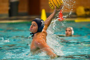 Intense Action At A Water Polo Game Wallpaper