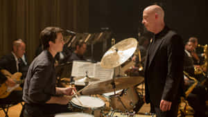 Intense Drumming Session Whiplash Movie Scene Wallpaper