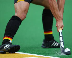 Intense Moment In A Field Hockey Game Wallpaper