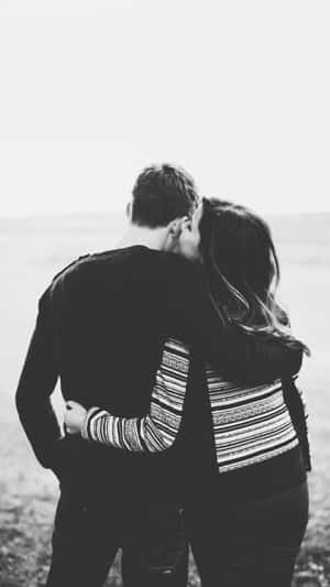 Intimate Couple Hug Blackand White Wallpaper