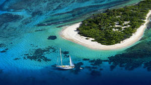 Island Surrounded With Azure Water Wallpaper