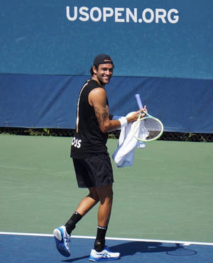 Italian Tennis Pro Matteo Berrettini Delighting In A Light Moment Wallpaper