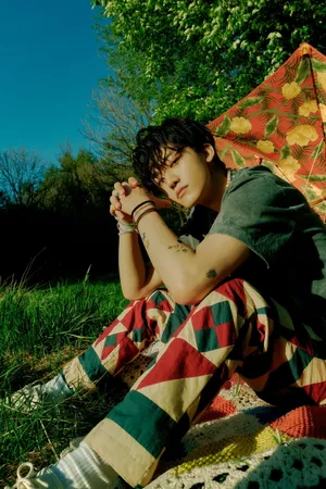 Jaemin Nct On Grass Wallpaper