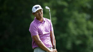 James Hahn Standing With Golf Club Wallpaper