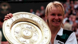 Jana Novotna Holding Her Championship Trophy Wallpaper