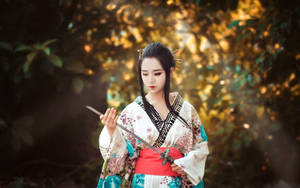 Japan Girl In A Kimono With A Sword Wallpaper