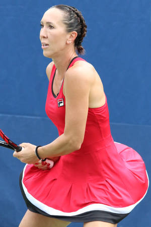 Jelena Jankovic In A Red Fila Dress On The Tennis Court Wallpaper