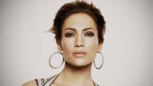 Jennifer Lopez With Signature Hoop Earrings Wallpaper