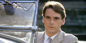 Jeremy Irons In A Riveting Scene From Munich Film Wallpaper