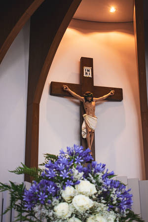 Jesus On Cross Statue On Chapel Wall Wallpaper