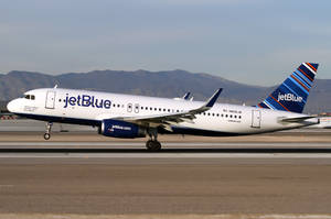 Jetblue Airways Plane On Airport Runway Wallpaper