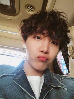 Jhope Cute Pouting Lips Inside Car Wallpaper