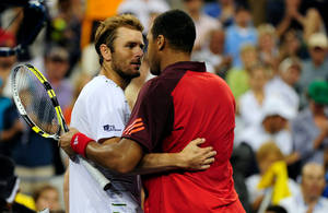 Jo-wilfried Tsonga Embracing His Opponent After A Tennis Match Wallpaper