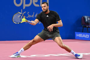 Jo-wilfried Tsonga's Precise Forehand Strike Wallpaper