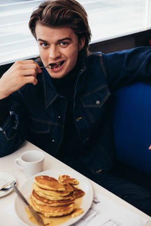 Joe Keery With Breakfast Wallpaper