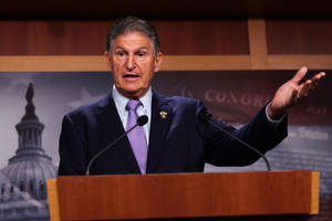 Joe Manchin Wearing A Purple Tie Wallpaper