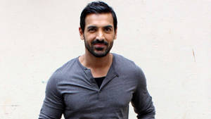 John Abraham In Grey Shirt Wallpaper