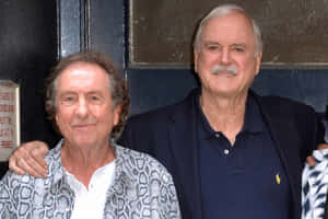 John Cleeseand Friend Smiling Wallpaper