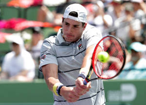 John Isner In Action Wallpaper